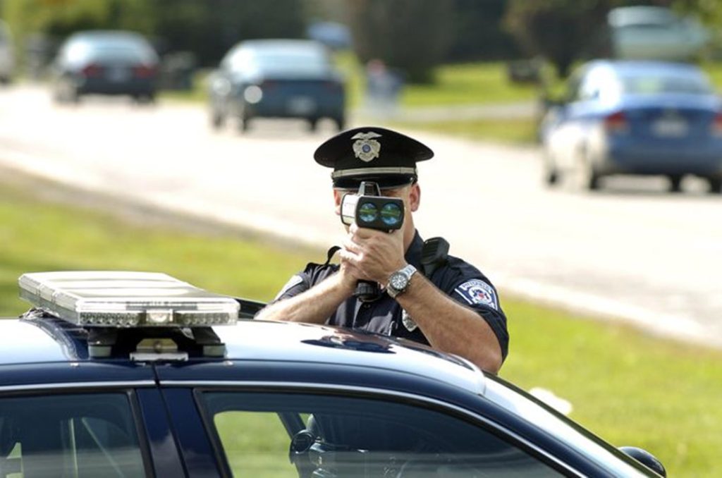 Officer with laser speed gun